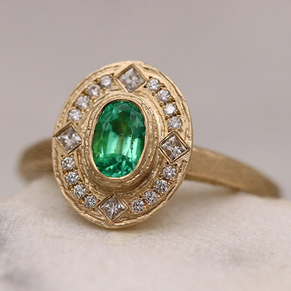 0.54ct Emerald And Diamond Textured Gold Halo Engagement Ring
