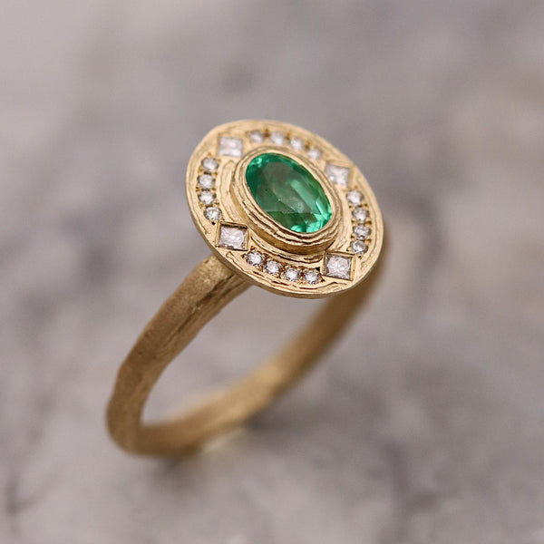0.54ct Emerald And Diamond Textured Gold Halo Engagement Ring