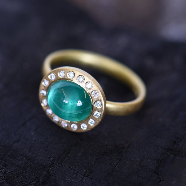 Cabochon Emerald And Diamond Halo Ring